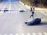 Motorcyclist Does an Amazing Triple Dismount off of a Speeding Car at Intersection