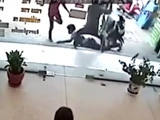 Guy Knocked Out With A Plank Of Wood Outside A Store