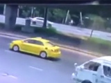 Biker Falls Off His Bike Straight Under A Fast Moving Car