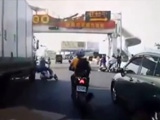 Scooter Rider Loses His Balance And Falls Under A Truck