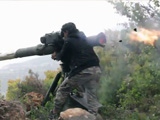 TOW Missile Fired Into Vehicle And A Crowd Of Men Around It