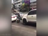 Driver escapes and runs over the bike