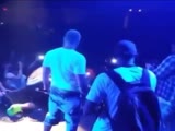 Concert Goer Gets His Ass Thrown Off Stage!