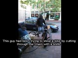 black guy stealing bike infront off crowded restaurant, and stabs womans purse!