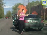 Woman Driver Strikes A Lighter To Determine Whether The Gas Cylinder She Is Carrying Is Leaking