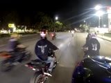 Pack of bikers are chased by copcars and helicopters