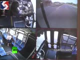 Driver falls out of seat, bus nearly hits train