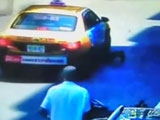 Driver Opens Door Sending Biker Under The Wheels Of A Taxi