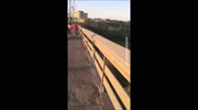 The girl was thrown off a bridge