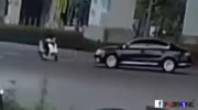 Car Sends Scooter Rider Sliding Across The Road