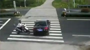 Female Scooter Rider Crashes Into A Car While Using Her Phone