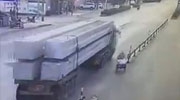 Man On A Trike Pulls Straight Under The Wheels Of A Truck