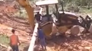 Backhoe Driver Has His Legs Cushed By Falling Concrete Pole