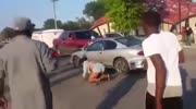 Car Hits some People that are in the road