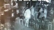 man hits woman`s head with a bottle