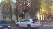 Turning Car Sends Biker Spinning Through The Air