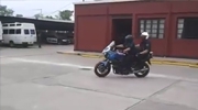 Motorcycle Cop Showing Off Her Skills Gets The Accelerator Caught Wide Open