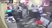 armed robber gets a bullet in back