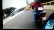 Biker falls and gets lightly hit by cop car after chase