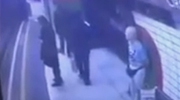 Man Pushes A Woman In A Hijab into A Passing Tube Train