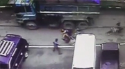 Scooter Riders Head Comes Within A Whisker Of Being Popped By A Truck