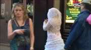 Woman walking around NYC with her tits out.