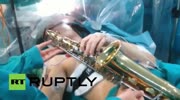Patient plays saxophone while surgeons remove brain tumour
