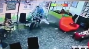 Motorcycle Crashes Through The Glass Front Doors Of A Shop