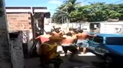 guy gets hit with a shovel in a head during street fight in favelas