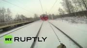 Crazy Russian daredevil ties himself to speeding train
