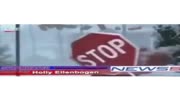 News reporter gets hit by stop sign