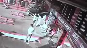 crash sends the car into tire shop