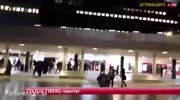 mob of masked men rampage through Stockholm station beating up refugees