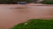 Bus washed away by flooded river