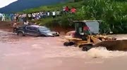 car full of people overturns in flooded river