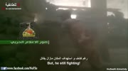 Iraqi fighter almost hit by RPG but keep on shooting