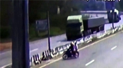 Couple On A Bike Ride Obliviously Under An Oncoming Truck