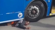 Drunk Man Stuck Under Bus Fully Awake While A Guy Berates Him