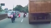 Biker Hits A Pedestrian Then Falls Directly Under A Passing Trucks Wheels