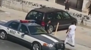 Man Knocks Out A Cop With A Spinning Jumping Kick After Standing On His Car Hood