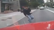 Man Dives Head First Into A Passing Cars Windshield