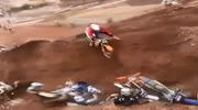 Cross riders fall one after another in the same pit