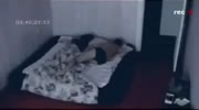 Weird CCTV footage of sleeping couple,.