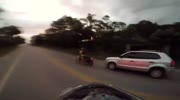 Biker Plays tag with a car in brazil