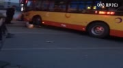 Women gets run over and stucked under bus wheel