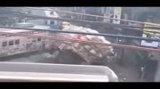 Bus hits the truck and its nearly falls on pedestrians