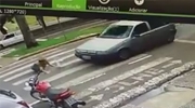 Woman Dives Head First Under A Passing Trucks Wheel On The Crosswalk