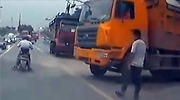 Truck Tire Explodes In Bystanders Face