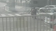 Wheel Flies off Passing Garbage Truck and Knocks Down Security Guard.