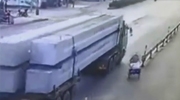 Cyclist Rides Directly Under The Wheels Of A Bus